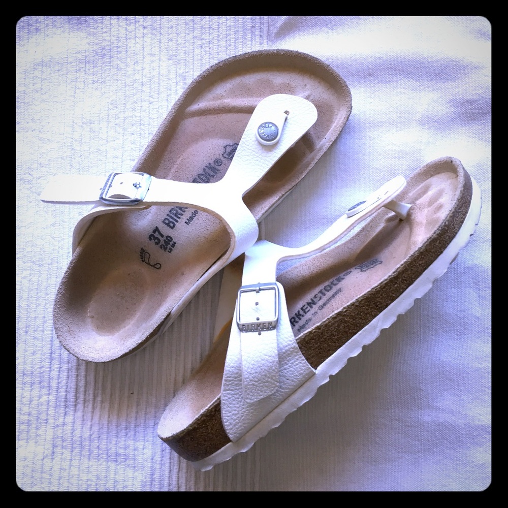 Birkenstock’s white sandals, brand new.